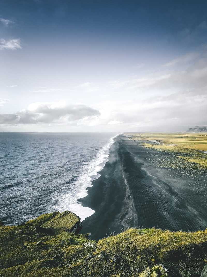 Shore with an iceberg in the back